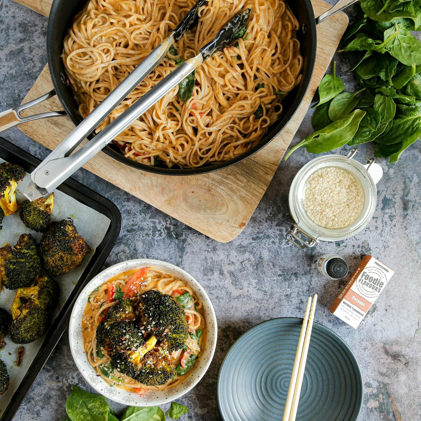 Community members collaborating in a modern kitchen space, sharing recipes and cooking techniques